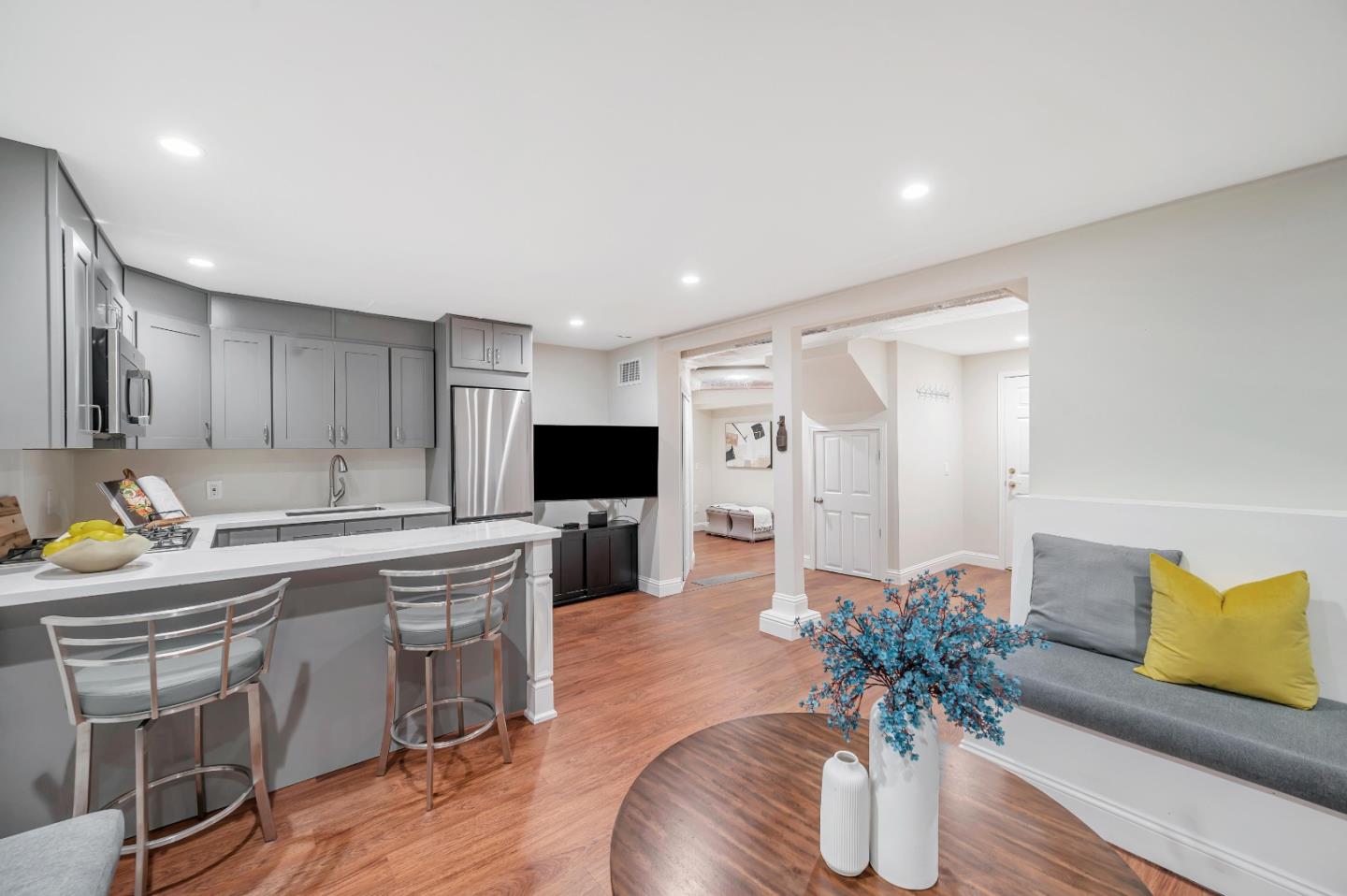 305 La Prenda Millbrae, CA 94030 - Photo 24 of 50 a living room with furniture potted plant and kitchen appliances