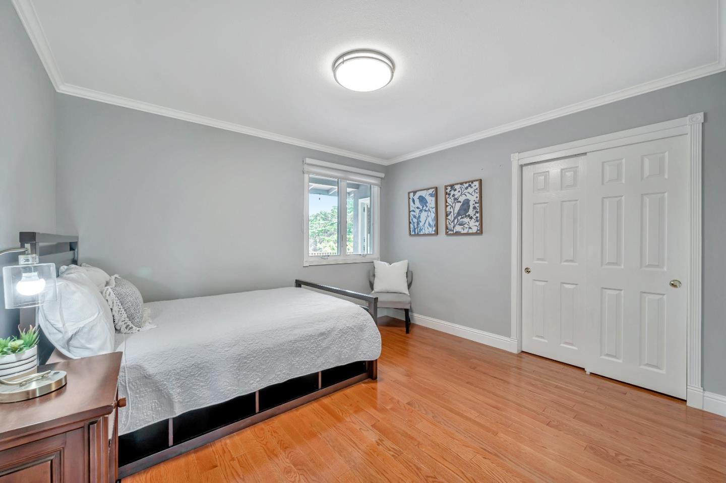 305 La Prenda Millbrae, CA 94030 - Photo 30 of 50 a bedroom with a bed and a window