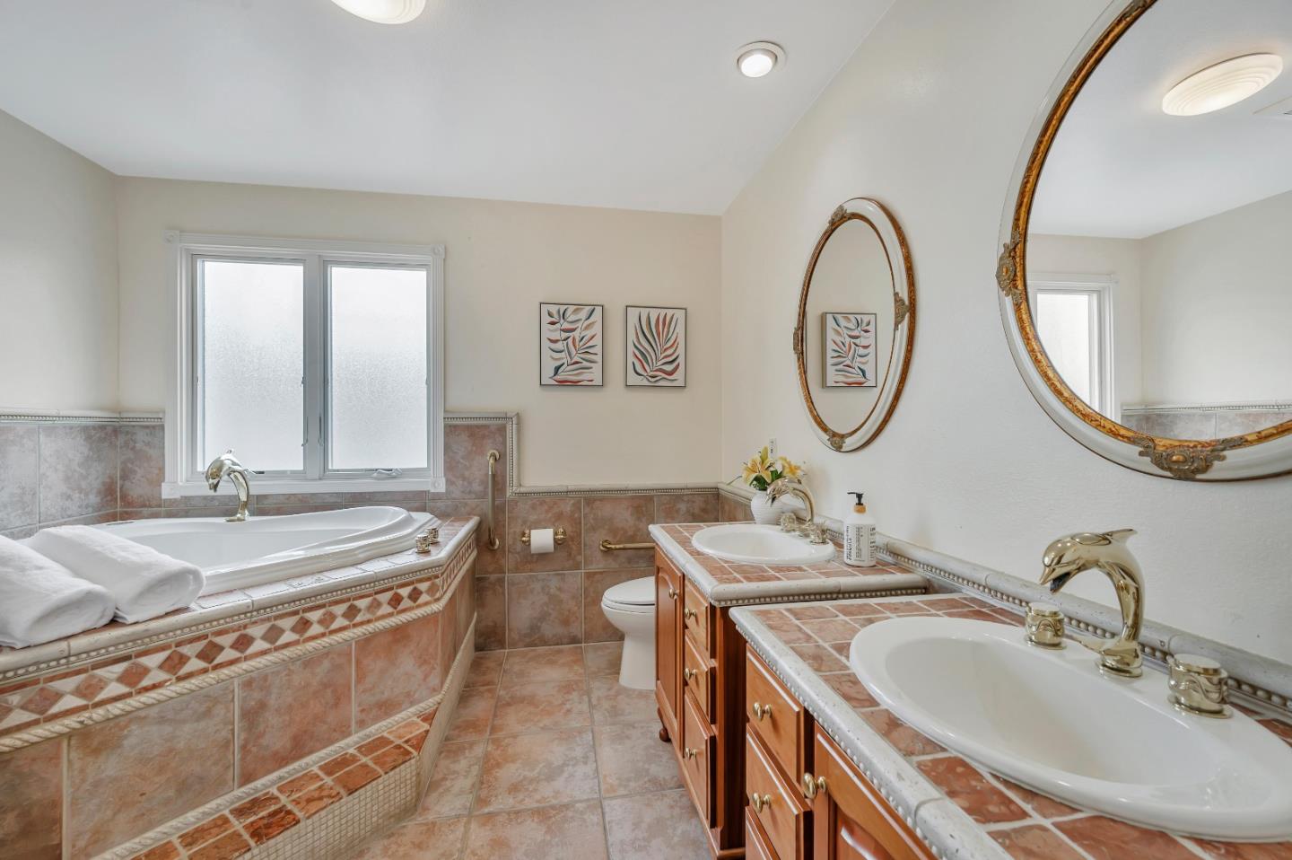 305 La Prenda Millbrae, CA 94030 - Photo 35 of 50 a bathroom with a granite countertop double vanity and a mirror