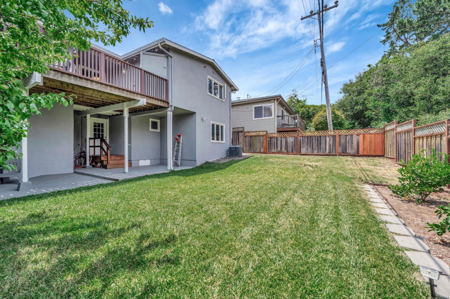 305 La Prenda Millbrae, CA 94030 - Photo 42 of 50 a view of a house with a yard plants and large tree