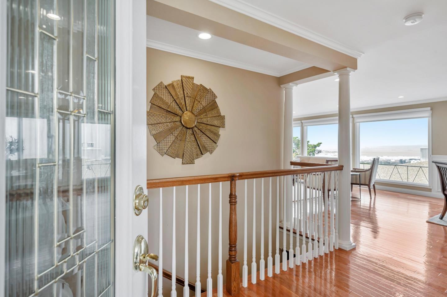 305 La Prenda Millbrae, CA 94030 - Photo 5 of 50 a view of a hallway with wooden floor and dining room