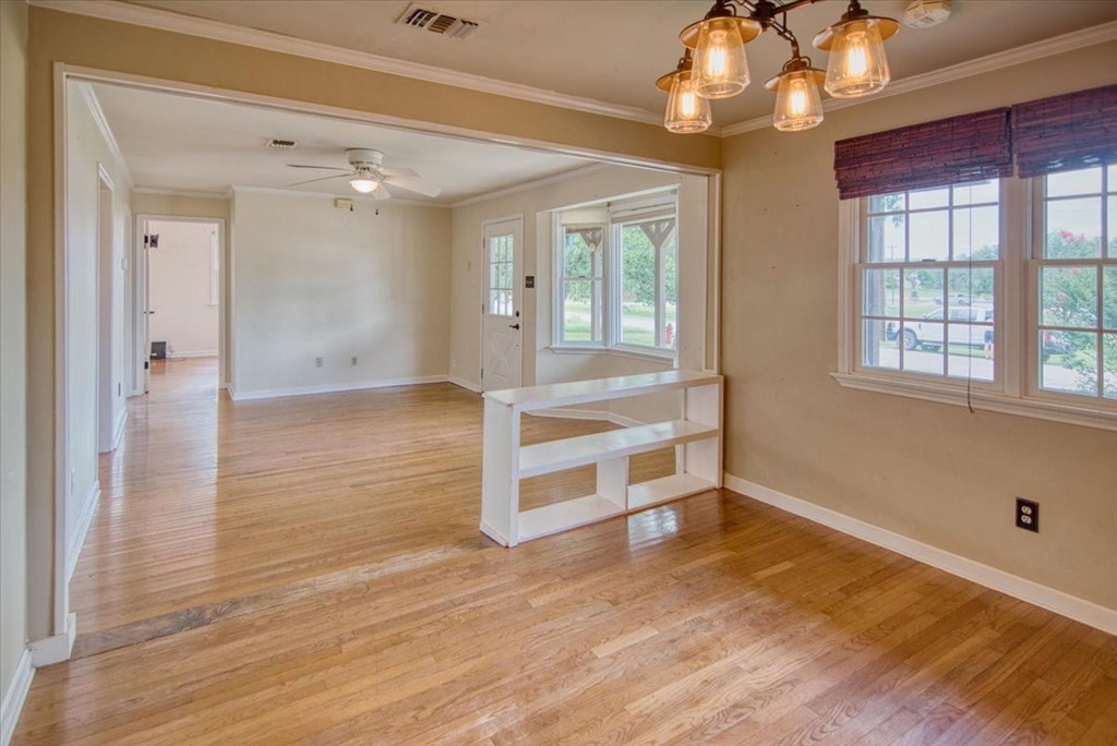 1013 Church Street Mason, TX 76856 - Photo 15 of 25 a view of an empty room with wooden floor and a window