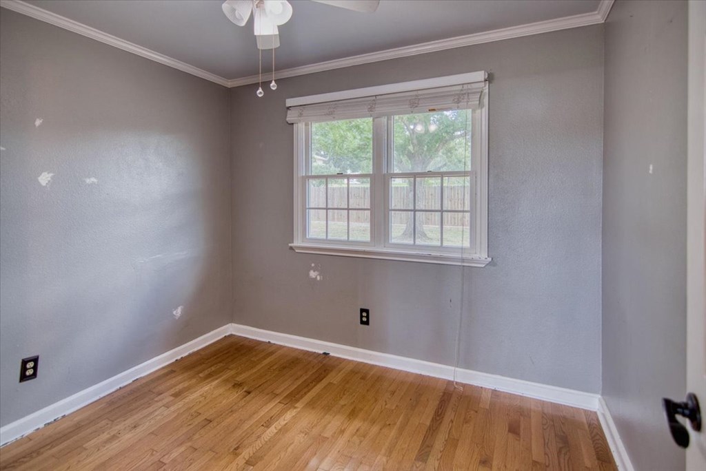 1013 Church Street Mason, TX 76856 - Photo 18 of 25 a view of empty room with wooden floor and fan