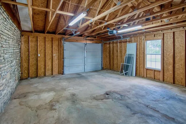 a view of an empty room with wooden walls