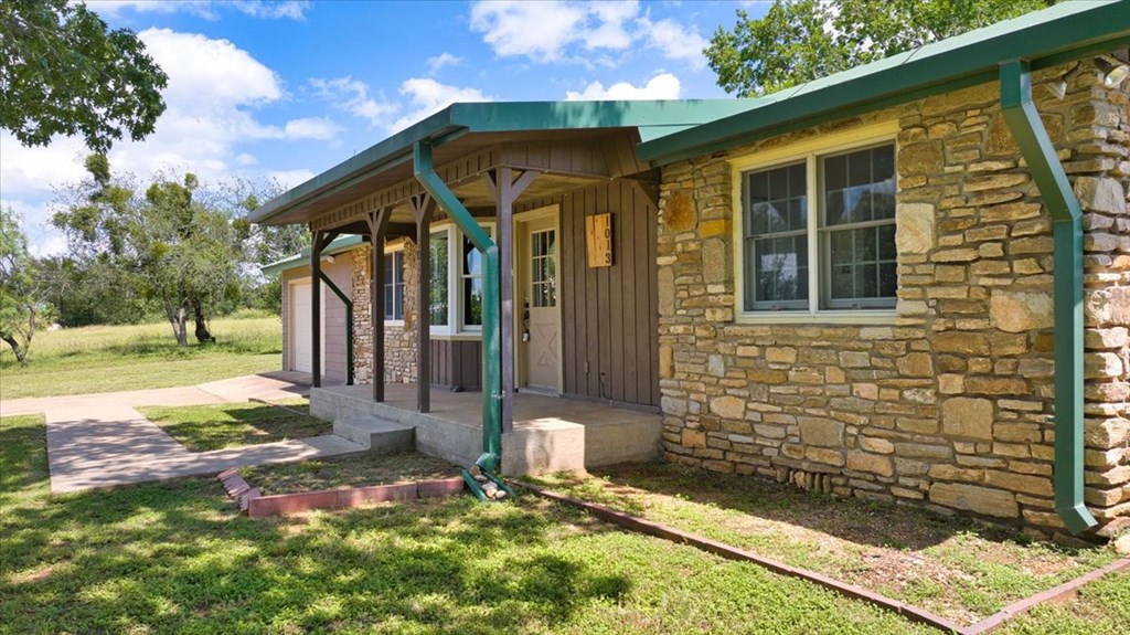 1013 Church Street Mason, TX 76856 - Photo 3 of 25 a front view of a house with a yard