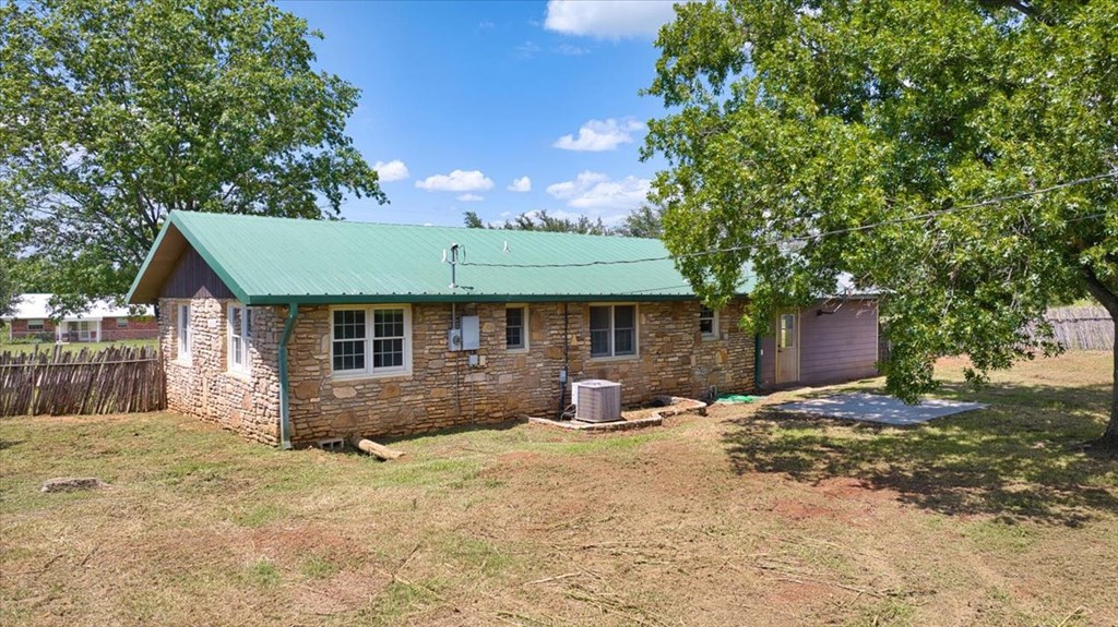 1013 Church Street Mason, TX 76856 - Photo 6 of 25 a front view of a house with a yard and garage