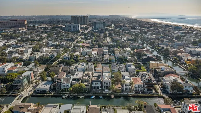 an aerial view of residential building and lake