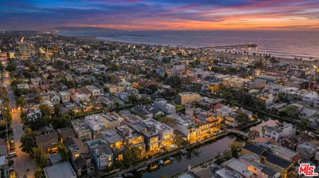 a view of a house with balcony and lake view