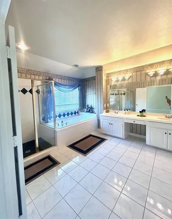 a kitchen with stainless steel appliances a stove a sink and a refrigerator