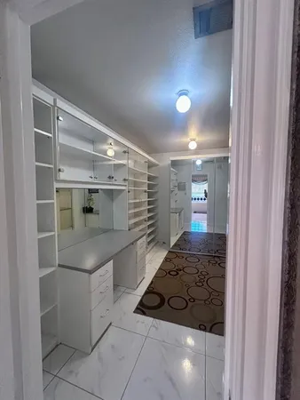 a bathroom with a sink and mirror