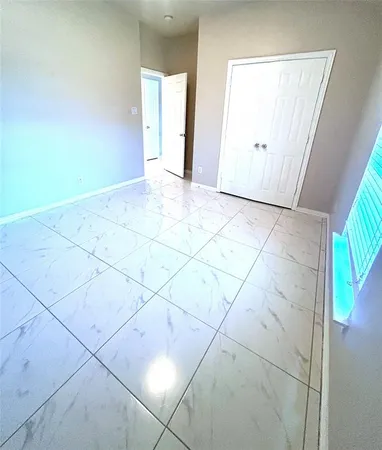 a view of an empty room and entryway