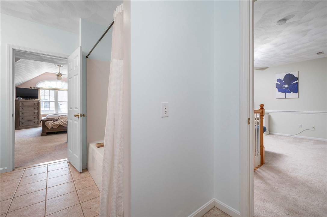 130 Bear Hill Road, Unit 302 Cumberland, RI 02864 - Photo 25 of 42 second floor primary full bathroom open to the cathedral bedroom and accessible to the loft space!