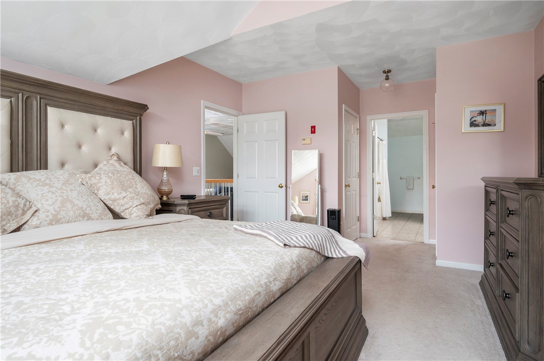 130 Bear Hill Road, Unit 302 Cumberland, RI 02864 - Photo 27 of 42 2nd floor primary bedroom -Cathedral ceilings, walk in closets and full bath!