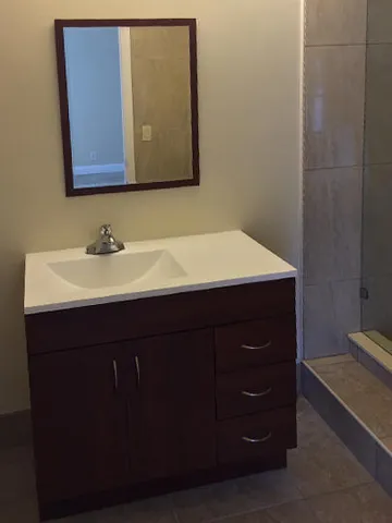 a bathroom with a sink and a mirror