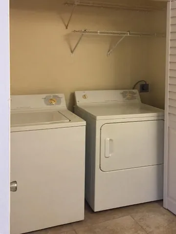 a utility room with dryer and washer