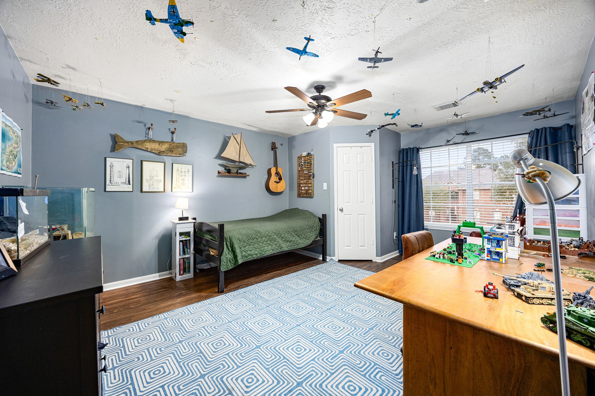 23107 Burcan Court Spring, TX 77373 - Photo 28 of 42 a bedroom with furniture and a chandelier