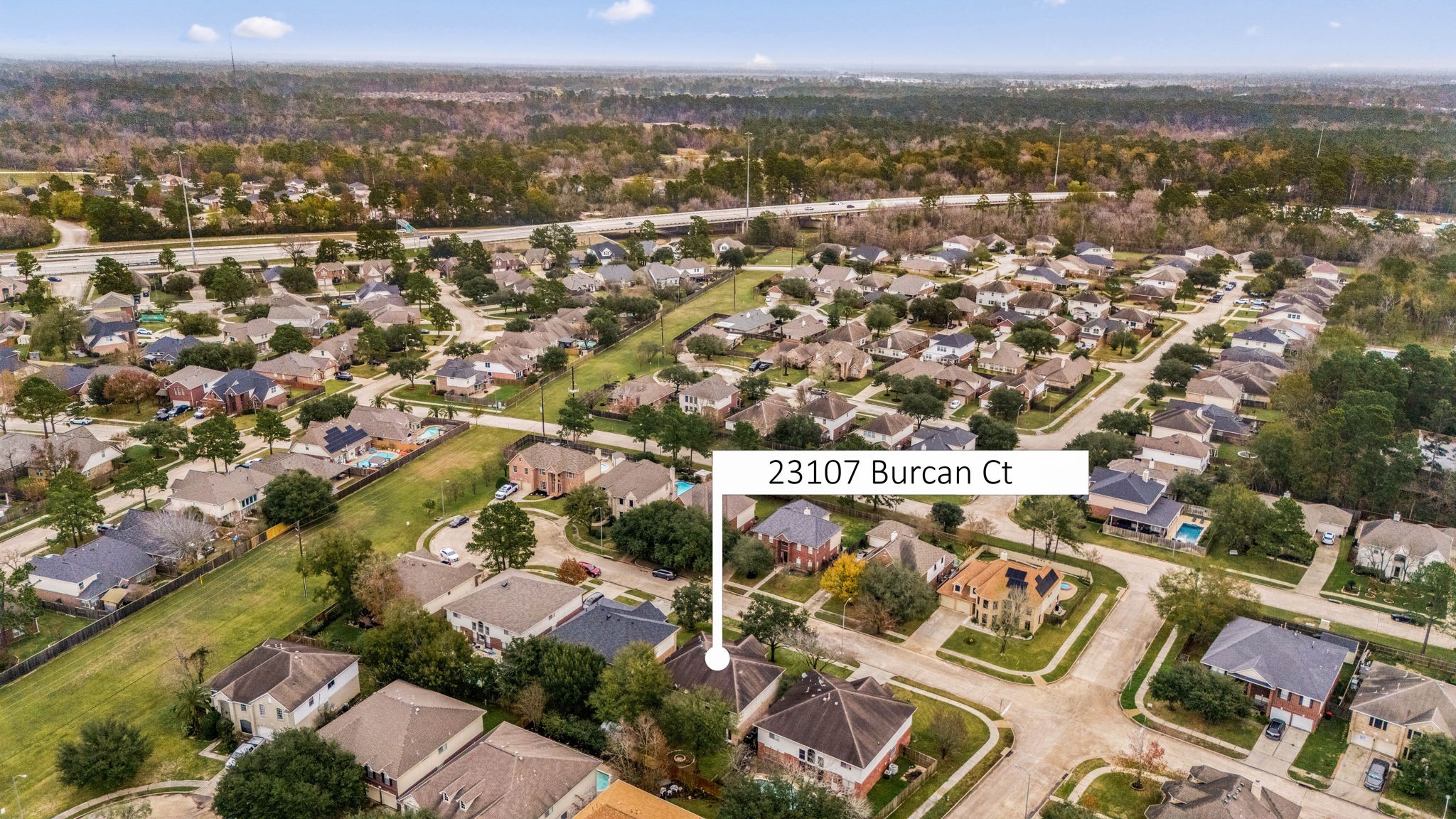 23107 Burcan Court Spring, TX 77373 - Photo 42 of 42 an aerial view of residential building with parking