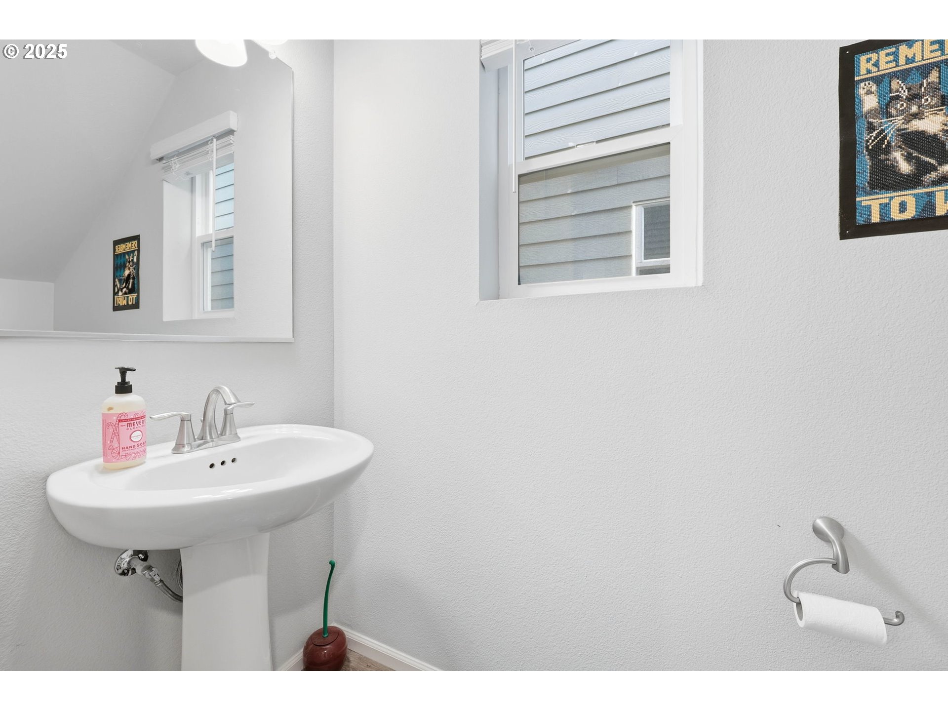 1316 19th Place Forest Grove, OR 97116 - Photo 15 of 36 a bathroom with a sink a mirror and a window