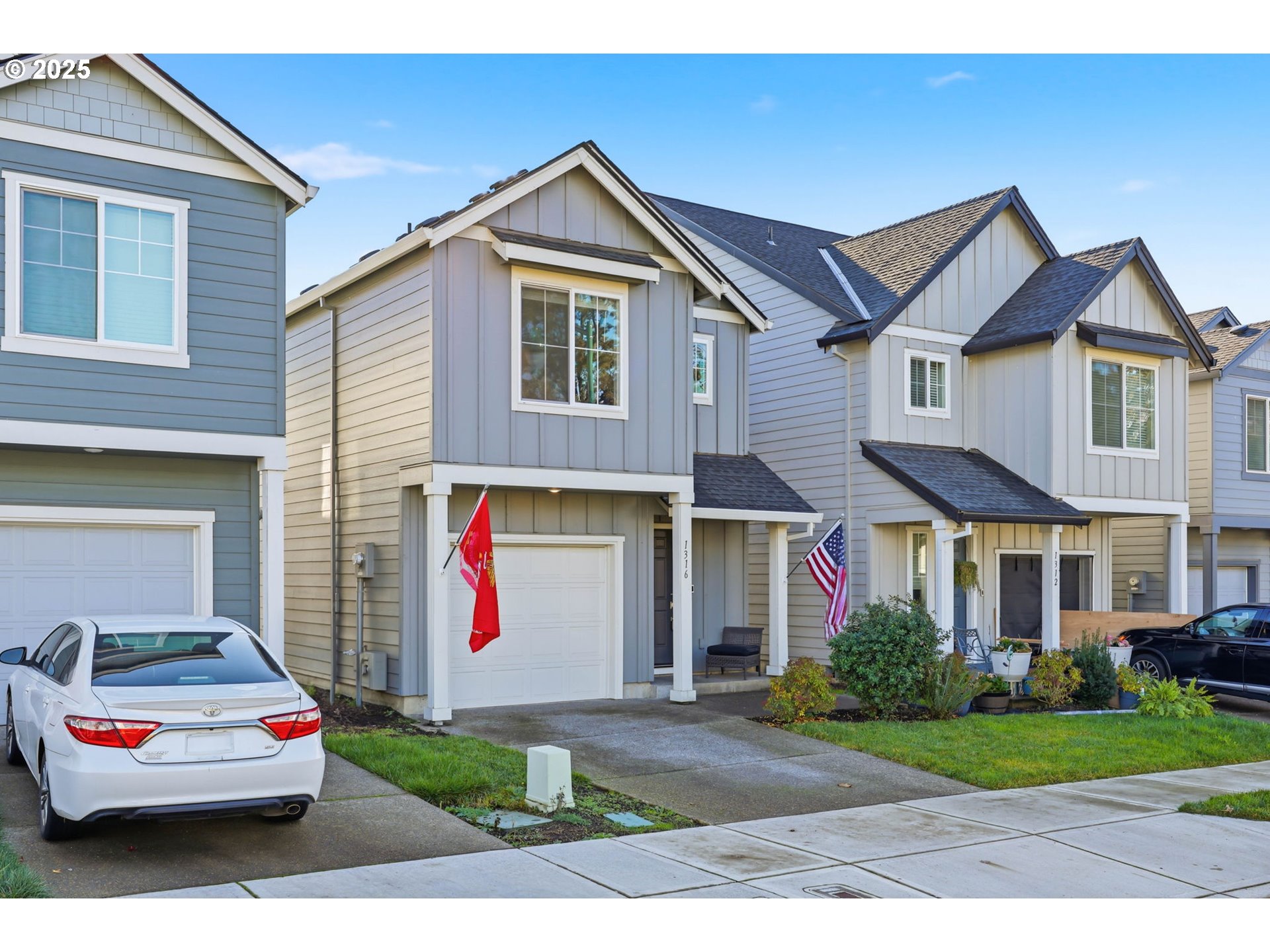 1316 19th Place Forest Grove, OR 97116 - Photo 2 of 36 a front view of a house with garage