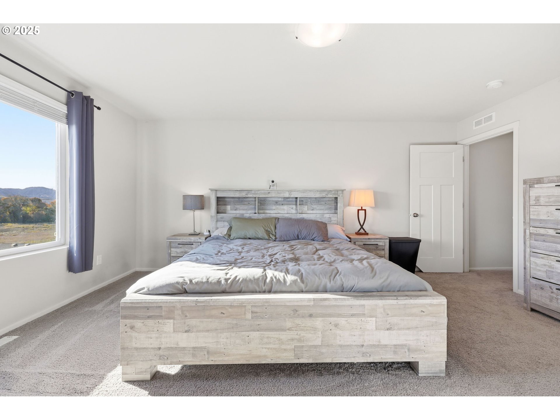 1316 19th Place Forest Grove, OR 97116 - Photo 22 of 36 a bedroom with a bed and window