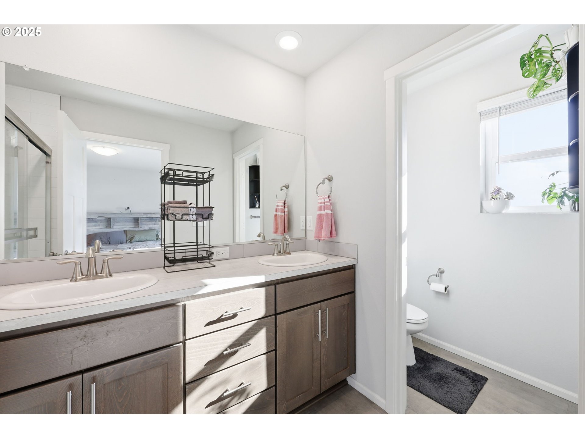 1316 19th Place Forest Grove, OR 97116 - Photo 25 of 36 a bathroom with a sink a toilet and mirror