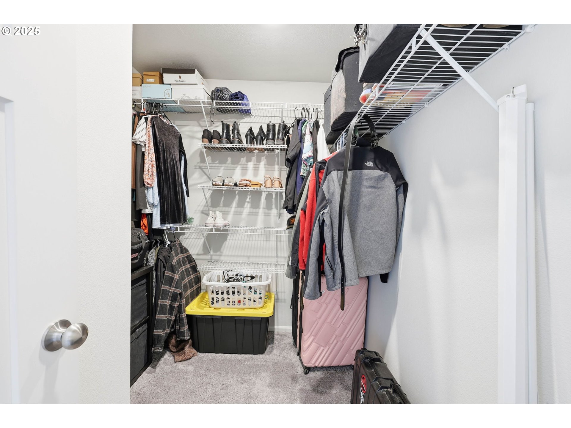 1316 19th Place Forest Grove, OR 97116 - Photo 27 of 36 a view of walk in closet with clothes and shoes