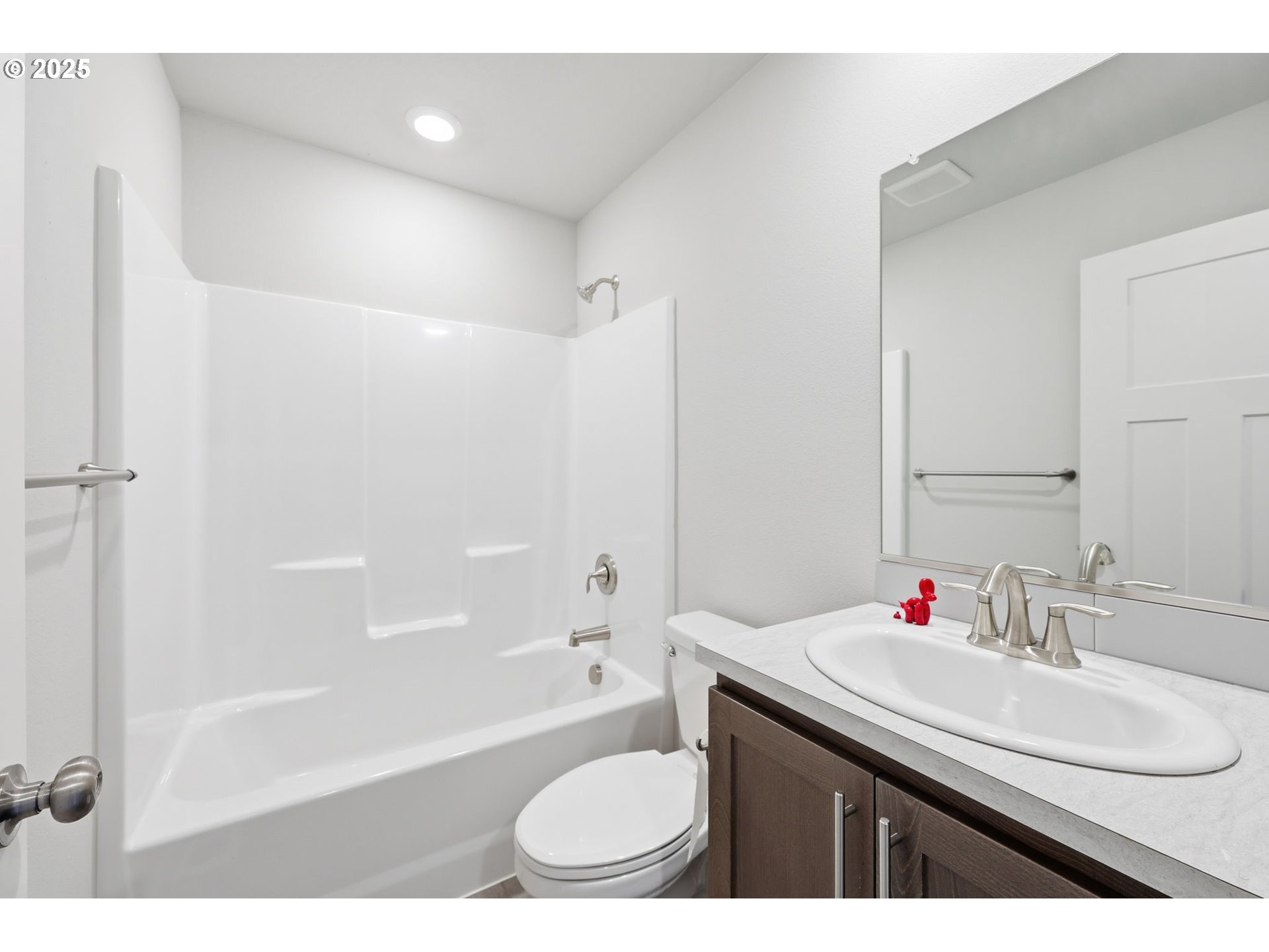 1316 19th Place Forest Grove, OR 97116 - Photo 29 of 36 a bathroom with a granite countertop sink toilet mirror and shower