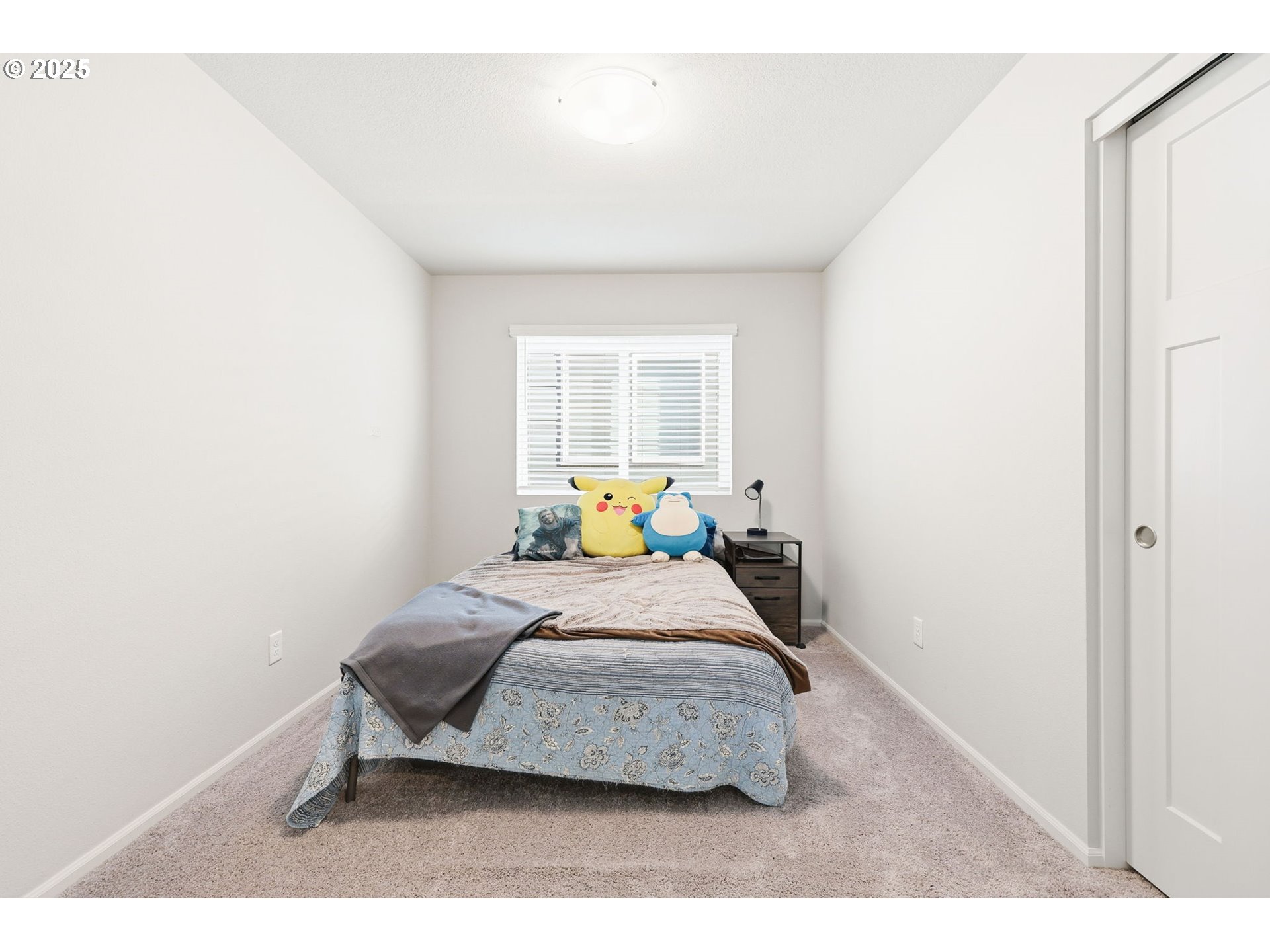 1316 19th Place Forest Grove, OR 97116 - Photo 32 of 36 a bedroom with a bed and a window