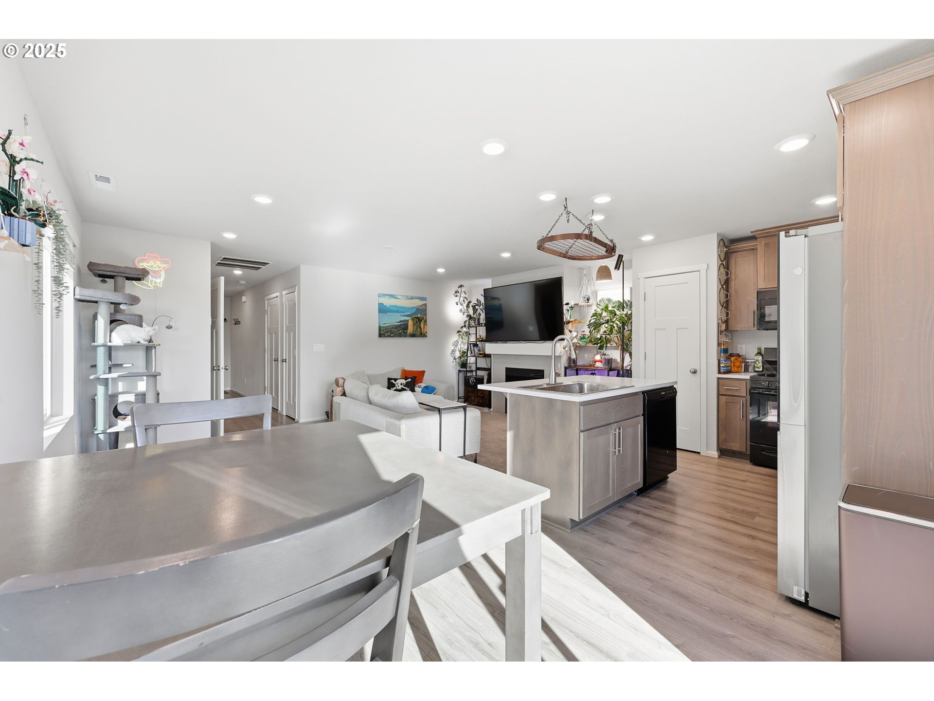1316 19th Place Forest Grove, OR 97116 - Photo 6 of 36 a kitchen with a refrigerator and a stove top oven