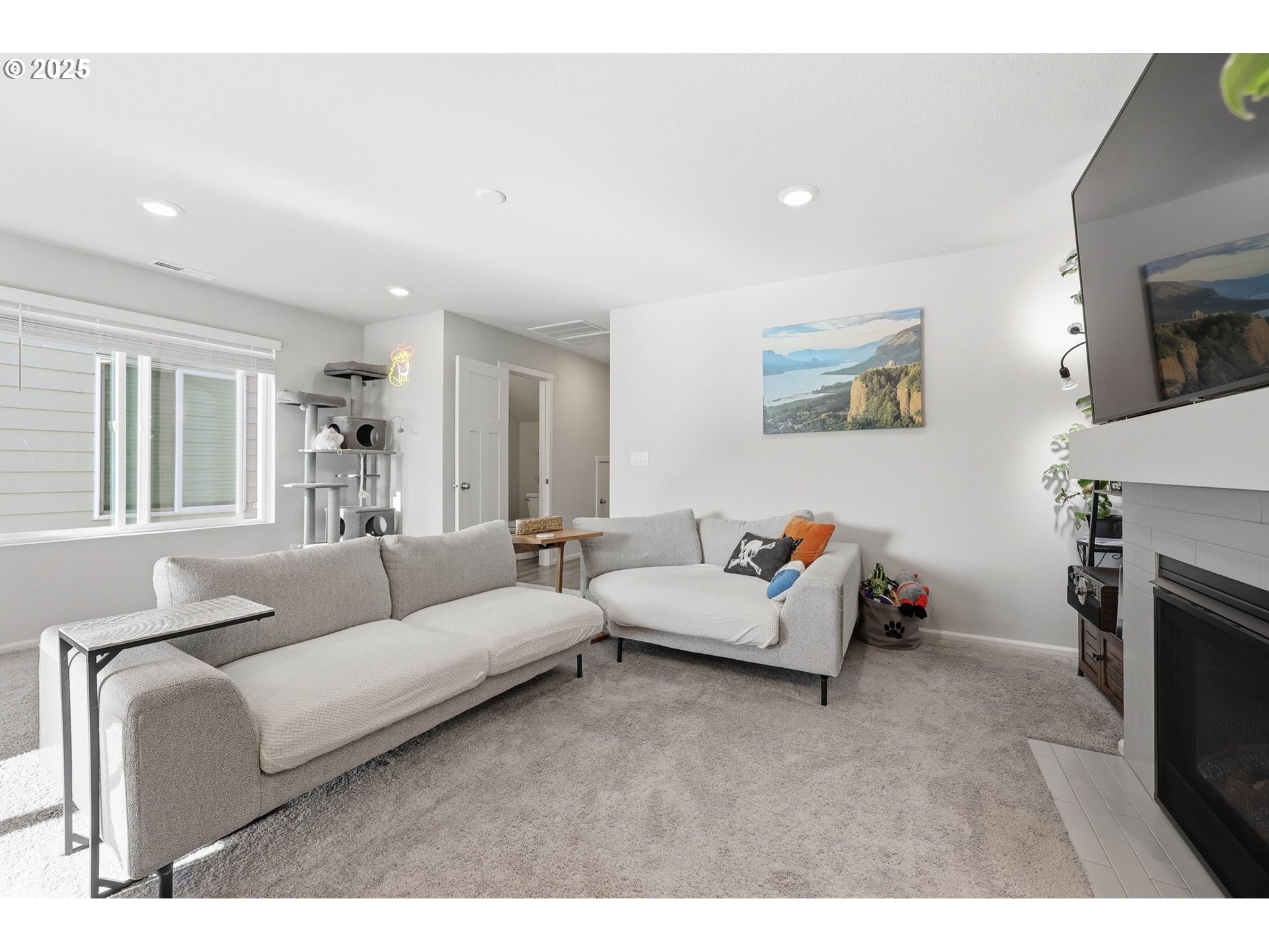 1316 19th Place Forest Grove, OR 97116 - Photo 10 of 36 a living room with furniture and a fireplace