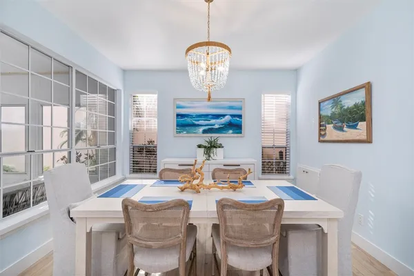a view of a dining room with furniture and wooden floor