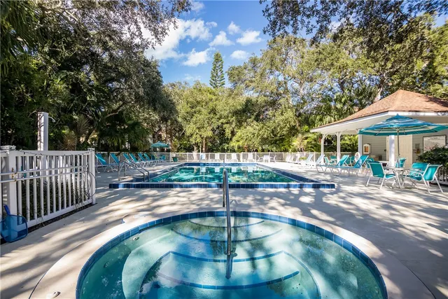 a view of a swimming pool with a patio