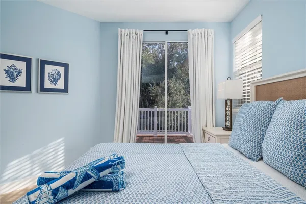 a backyard of a house with plants and trees