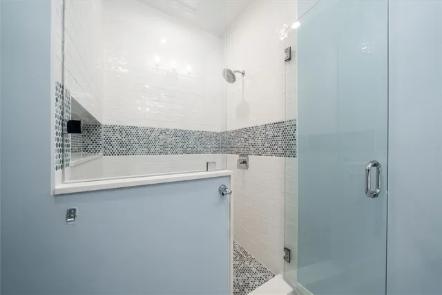 a bathroom with a sink and mirror