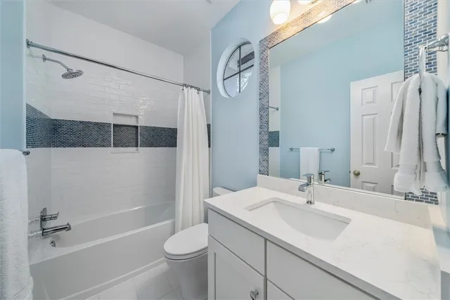 an aerial view of a houses with outdoor space and lake view