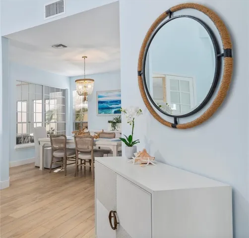 a very nice looking dining room with a large window