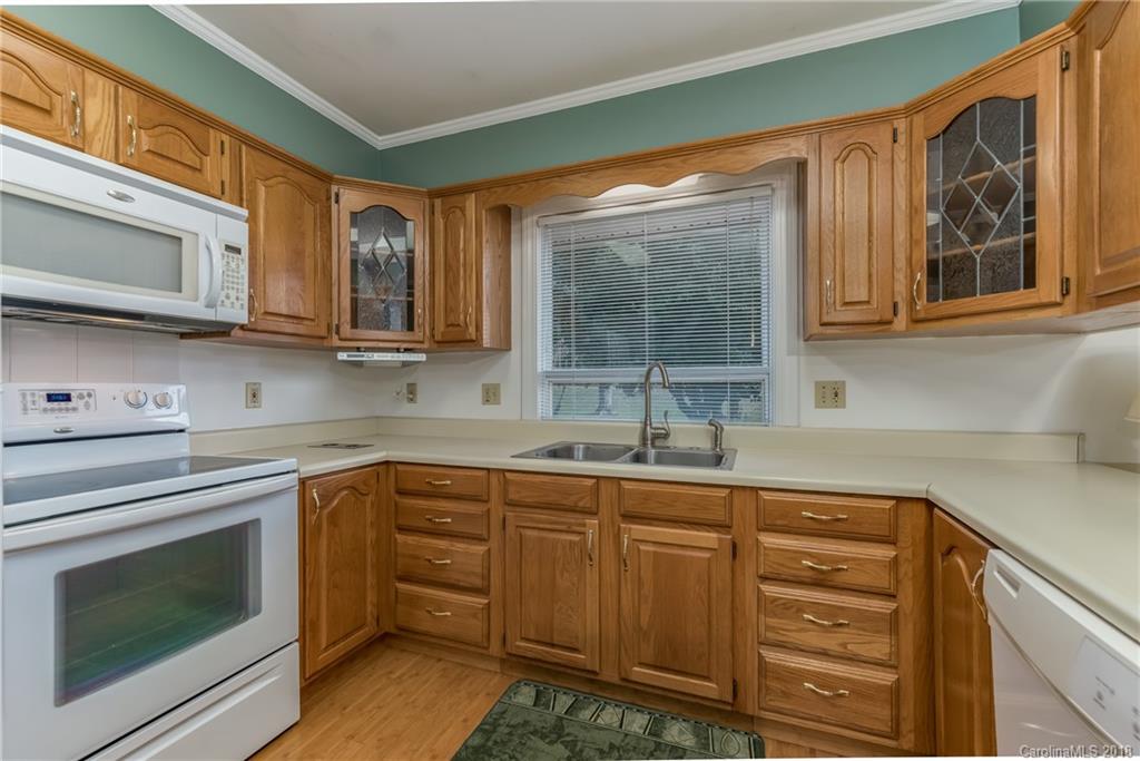 541 North Main Street Rutherfordton, NC 28139 - Photo 2 of 35 a kitchen with stainless steel appliances granite countertop a sink stove and cabinets