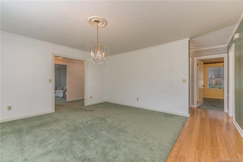 541 North Main Street Rutherfordton, NC 28139 - Photo 11 of 35 a view of a room with wooden floor and a chandelier