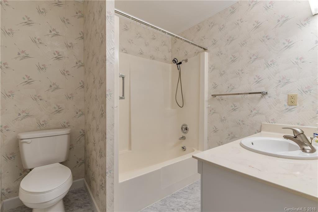 541 North Main Street Rutherfordton, NC 28139 - Photo 15 of 35 a bathroom with a sink a toilet and shower