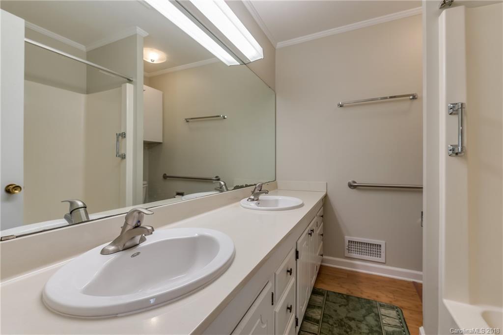 541 North Main Street Rutherfordton, NC 28139 - Photo 5 of 35 a bathroom with a double vanity sink and a mirror