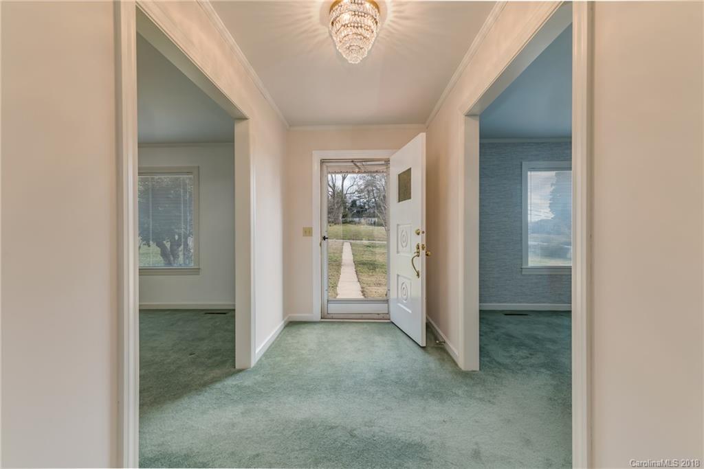 541 North Main Street Rutherfordton, NC 28139 - Photo 8 of 35 a view of a hallway with a livingroom