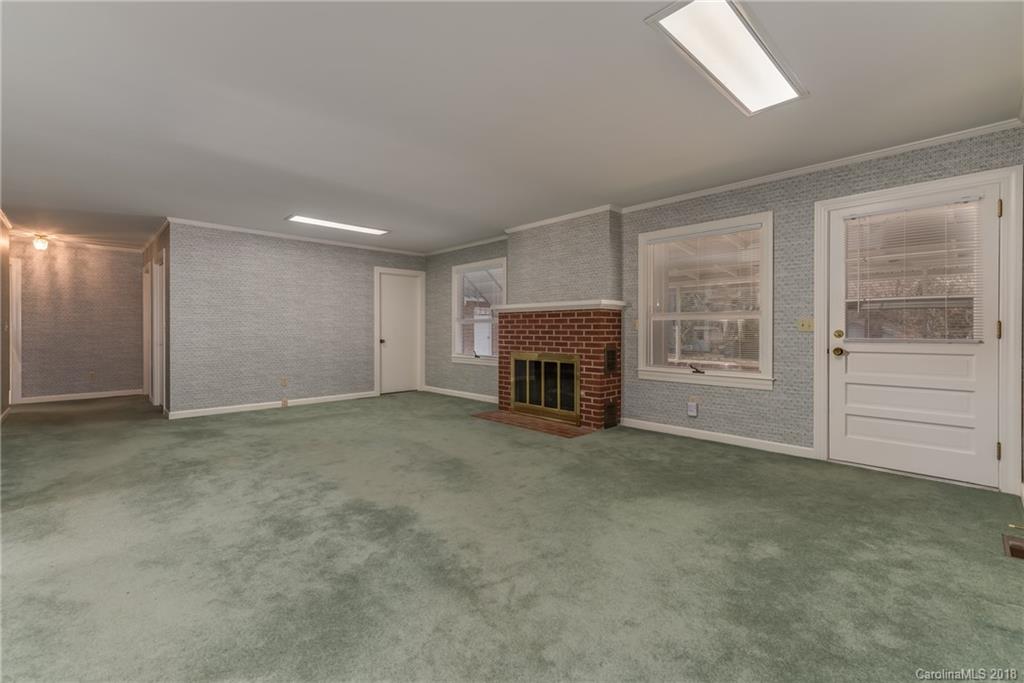 541 North Main Street Rutherfordton, NC 28139 - Photo 10 of 35 an empty room with furniture and a fireplace