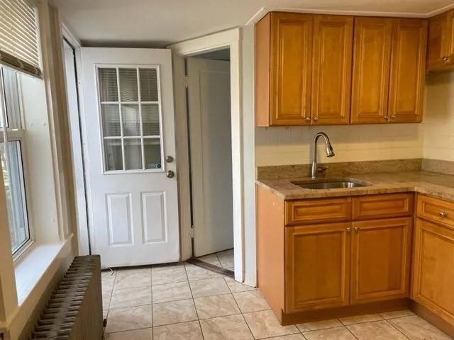 2 Brookside Avenue, Unit 2D Worcester, MA 01602 - Photo 5 of 9 a kitchen with a sink and a window