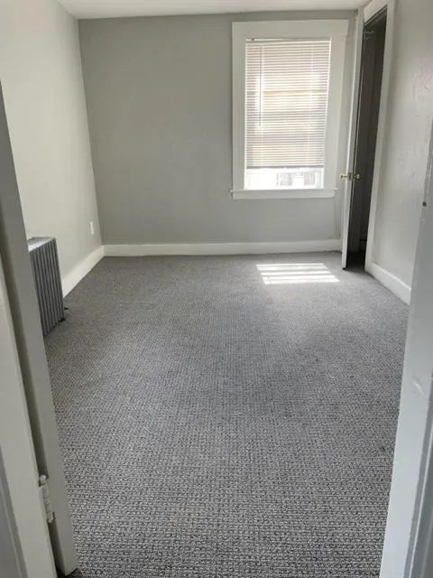 2 Brookside Avenue, Unit 2D Worcester, MA 01602 - Photo 8 of 9 an empty room with a window