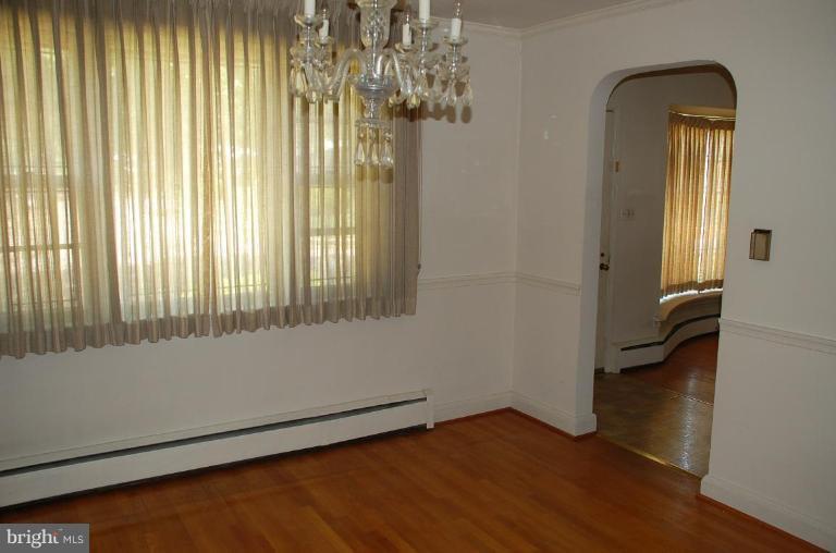 3105 Bonnie Road Baltimore, MD 21209 - Photo 4 of 10 a view of an empty room with a window
