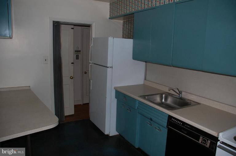 3105 Bonnie Road Baltimore, MD 21209 - Photo 5 of 10 a kitchen with a sink and cabinets