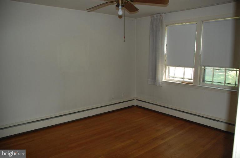3105 Bonnie Road Baltimore, MD 21209 - Photo 7 of 10 an empty room with a window