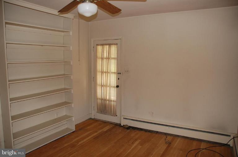 3105 Bonnie Road Baltimore, MD 21209 - Photo 8 of 10 a view of an empty room with a window