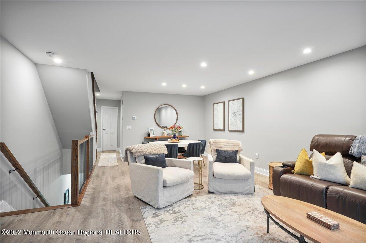 5 Island View Way, Unit 10 Sea Bright, NJ 07760 - Photo 11 of 30 a living room with furniture and a wooden floor
