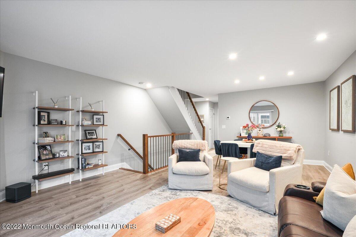 5 Island View Way, Unit 10 Sea Bright, NJ 07760 - Photo 13 of 30 a living room with furniture and a wooden floor